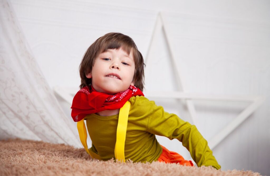Mastering the First Impression: Your intriguing post title goes here Young child posing indoors with a playful expression and bright clothing.